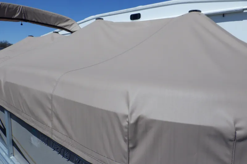 Slide: The Image of 2009 Premier 225 Sunsation LTD boat with beige cover, side view. - 49