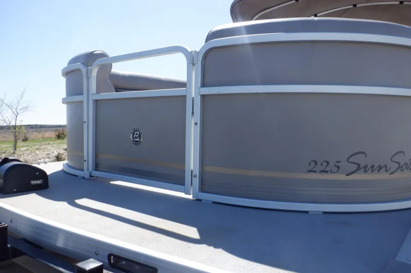 Slide: The Image of 2009 Premier 225 Sunsation LTD pontoon boat, side view, on a sunny day. - 9