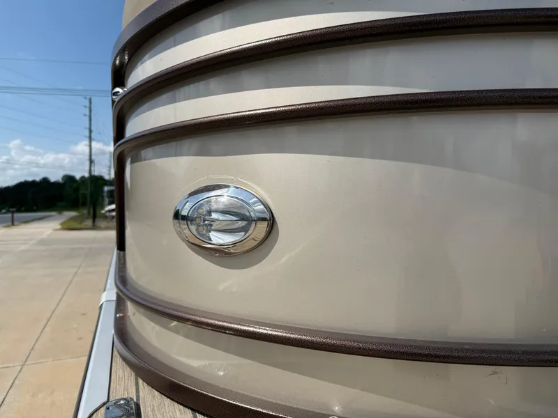 Slide: The Image of 2023 Veranda VTX 22RC boat exterior with logo, sunny day, close-up view. - 14