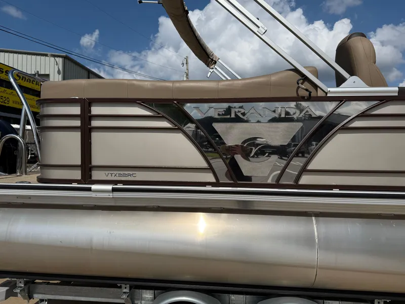 Slide: The Image of 2023 Veranda VTX 22RC pontoon boat with sleek design and beige upholstery. - 15