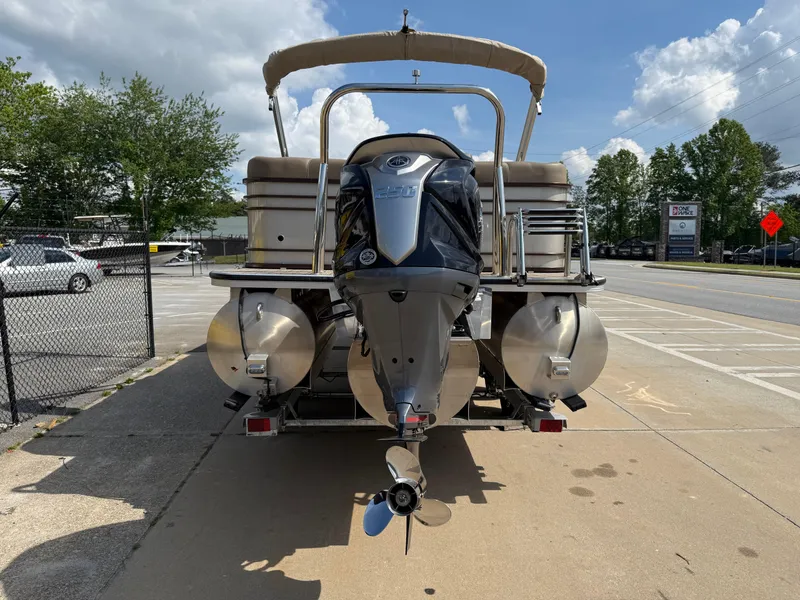Slide: The Image of 2023 Veranda VTX 22RC pontoon boat with outboard motor, parked on a sunny day. - 18