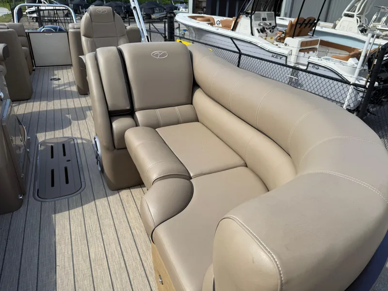 Slide: The Image of 2023 Veranda VTX 22RC boat with beige leather seating and spacious deck layout. - 27