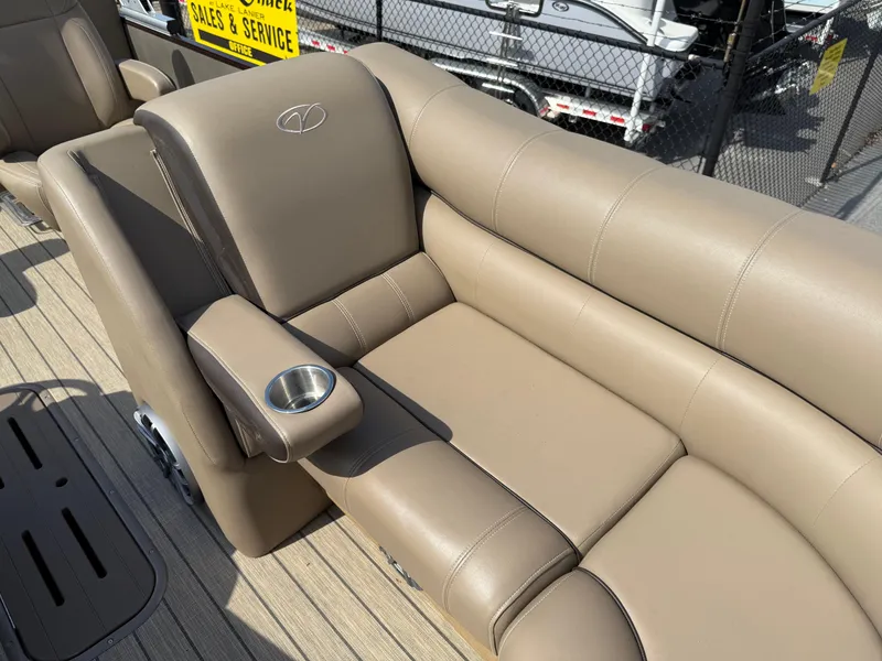 Slide: The Image of 2023 Veranda VTX 22RC boat seat with beige upholstery and cup holder. - 28