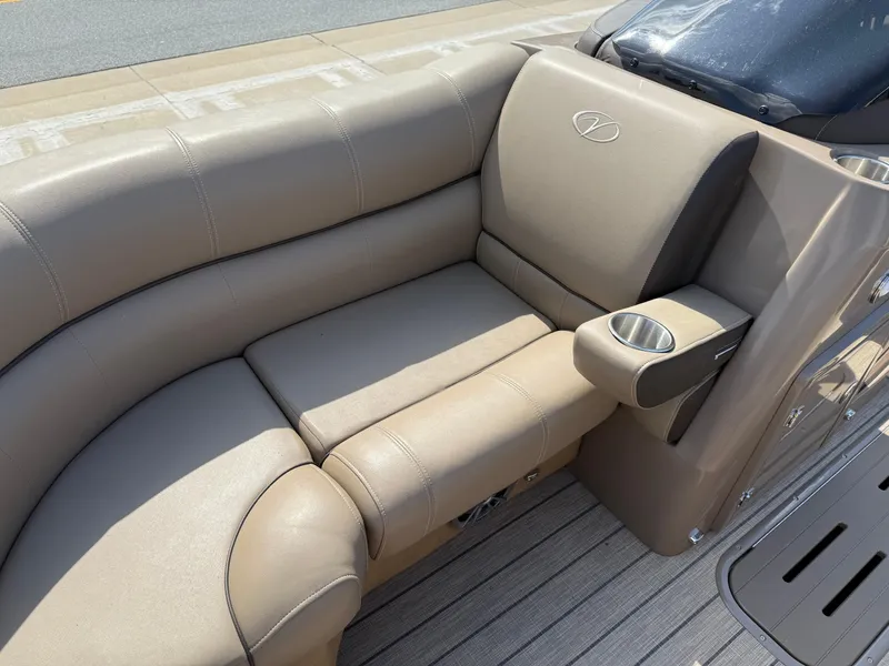 Slide: The Image of 2023 Veranda VTX 22RC boat interior with beige leather seating and cup holder. - 29