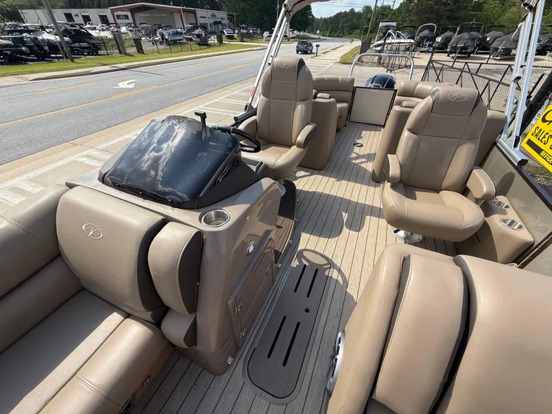 Slide: The Image of 2023 Veranda VTX 22RC pontoon boat interior with tan seating and helm. - 30