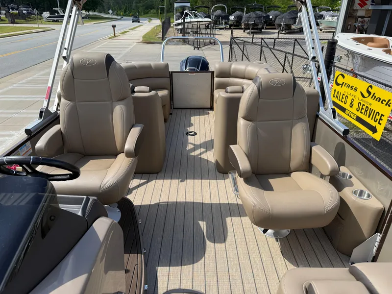 Slide: The Image of 2023 Veranda VTX 22RC pontoon boat interior with beige seating and wood-style flooring. - 31