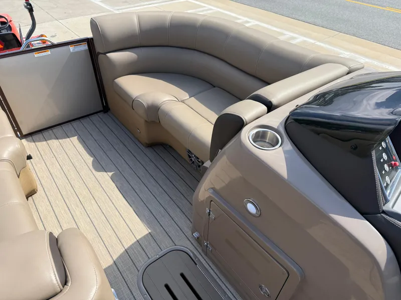 Slide: The Image of 2023 Veranda VTX 22RC boat interior with beige seating and wood-style flooring. - 35