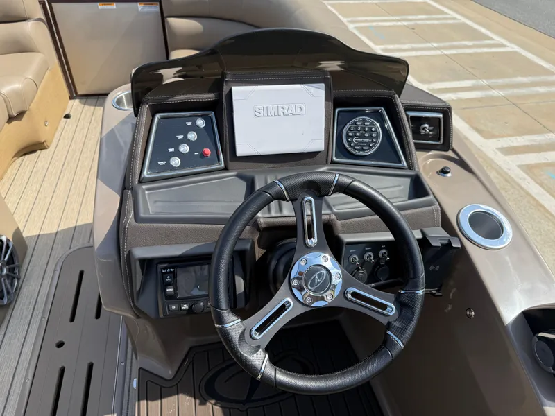Slide: The Image of 2023 Veranda VTX 22RC boat dashboard with steering wheel and control panel. - 37