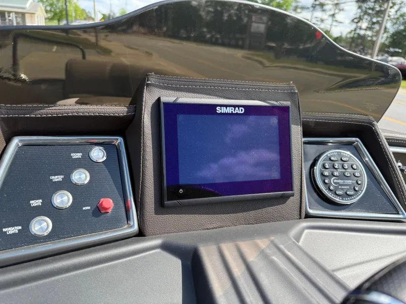 Slide: The Image of 2023 Veranda VTX 22RC dashboard featuring Simrad display and control panel. - 39
