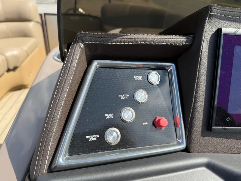 Slide: The Image of Control panel of 2023 Veranda VTX 22RC boat with various switches and buttons. - 41