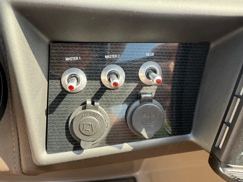 Slide: The Image of Control panel of 2023 Veranda VTX 22RC with switches and 12V outlets. - 43