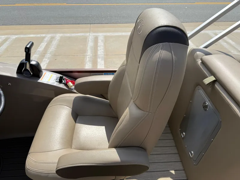Slide: The Image of 2023 Veranda VTX 22RC boat seat with beige upholstery and control panel. - 46