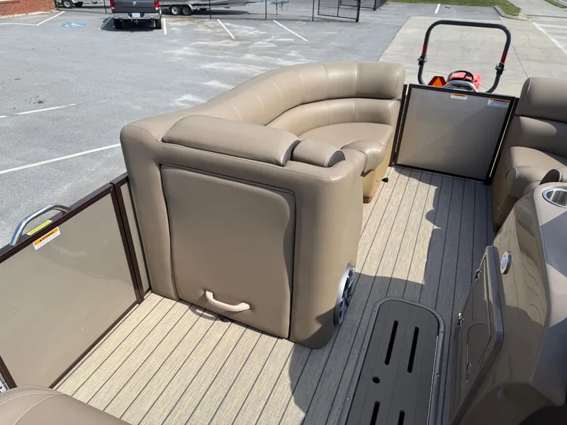 Slide: The Image of 2023 Veranda VTX 22RC pontoon boat interior with beige seating and open gate. - 48