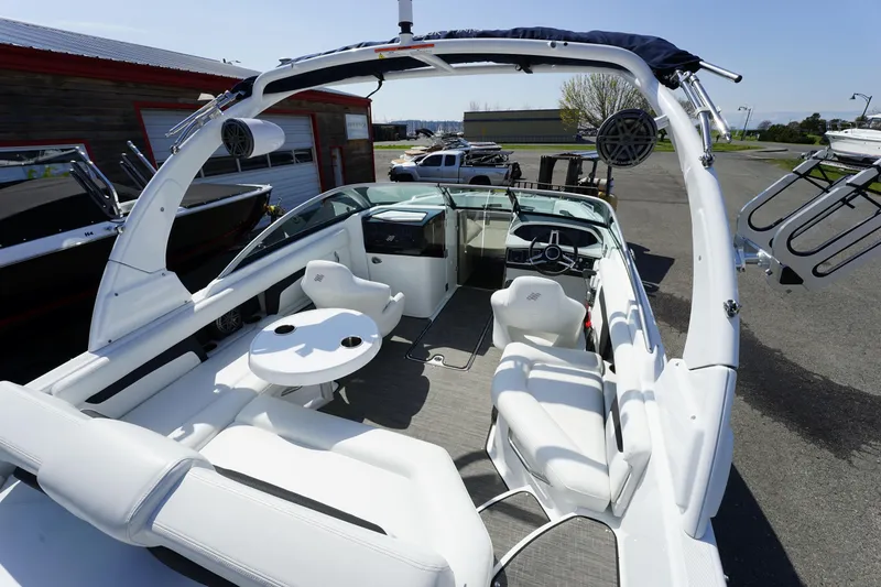 Slide: The Image of 2023 Four Winns HD3 Surf boat with sleek white interior and modern design. - 12