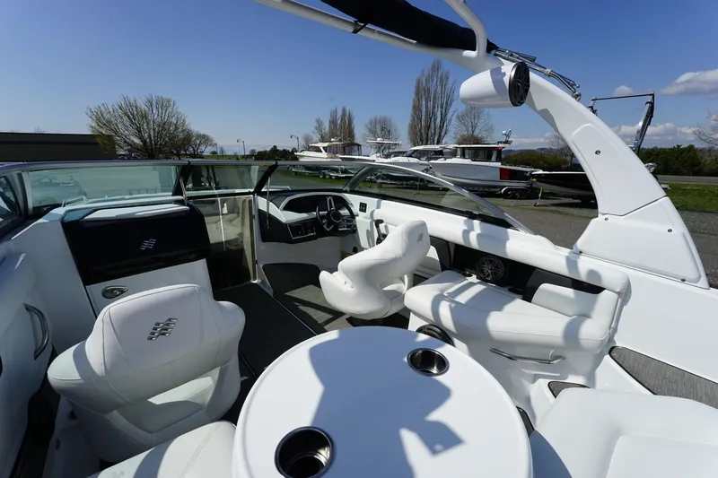 Slide: The Image of 2023 Four Winns HD3 Surf boat interior with white seating and sleek design. - 16