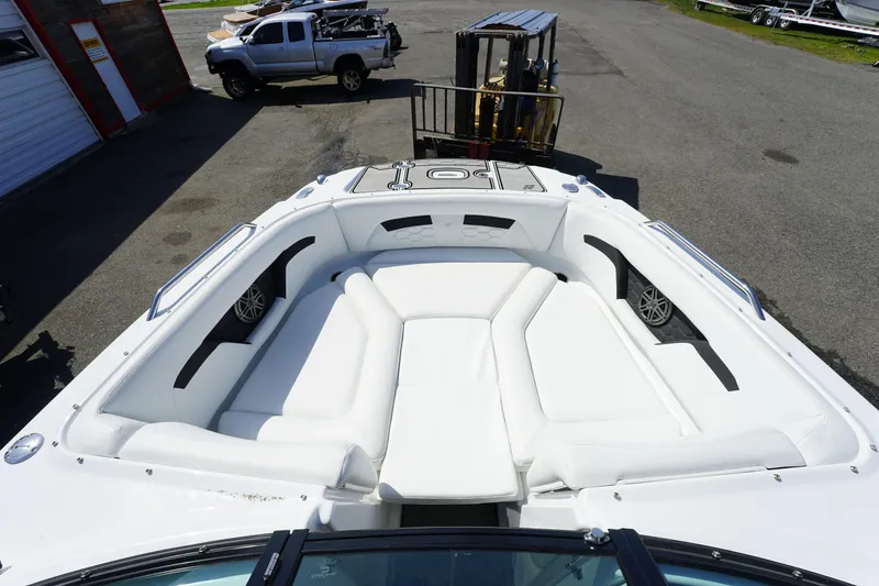 Slide: The Image of 2023 Four Winns HD3 Surf boat with spacious white seating area. - 22