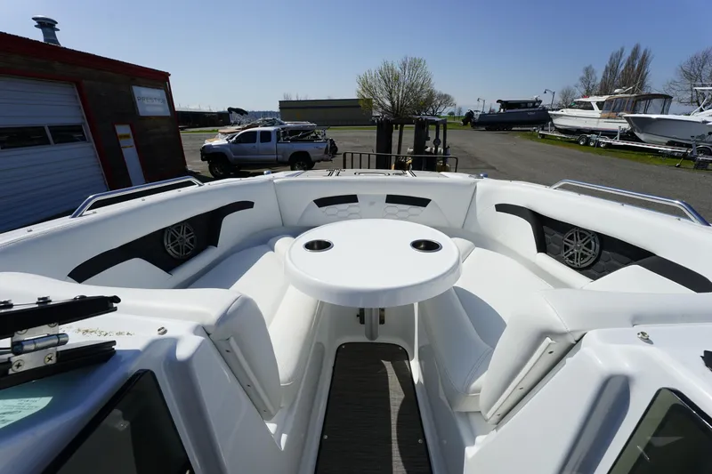 Slide: The Image of 2023 Four Winns HD3 Surf boat interior with seating and table. - 24