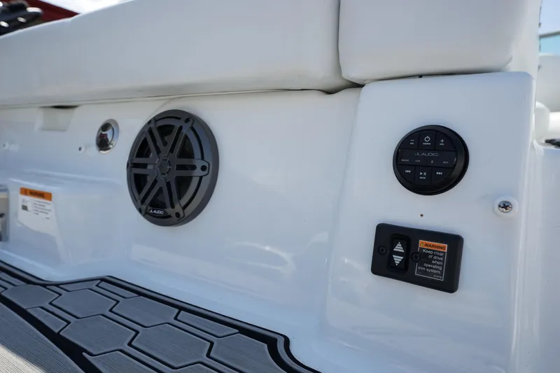 Slide: The Image of 2023 Four Winns HD3 Surf boat interior with speaker and control panel. - 28