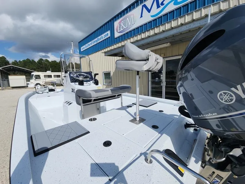Slide: The Image of 2025 Xpress H210 BAY boat with Yamaha engine, displayed outside a dealership. - 3
