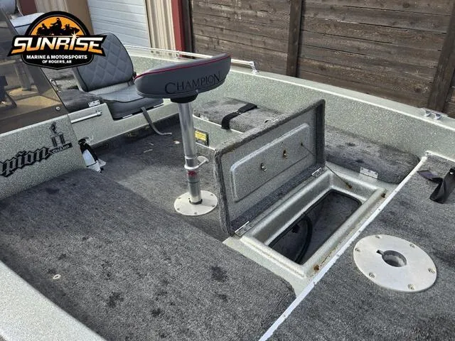 Slide: The Image of 1984 Champion CHAMP 2 boat interior with storage compartment and seat, Sunrise Marine logo visible. - 11