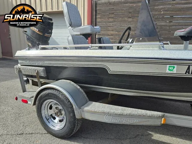 Slide: The Image of 1984 Champion CHAMP 2 boat on trailer, parked outdoors at Sunrise Marine & Motorsports. - 12
