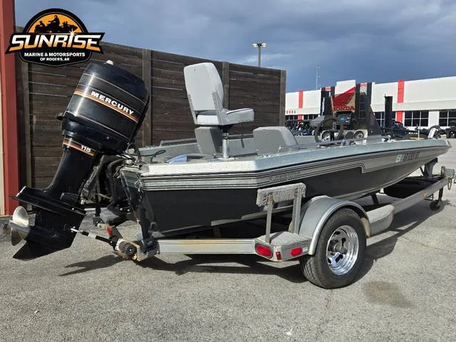 Slide: The Image of 1984 Champion CHAMP 2 boat with Mercury 115 outboard motor on a trailer. - 13