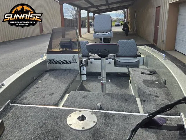 Slide: The Image of 1984 Champion CHAMP 2 boat interior with gray seating and carpet, displayed at Sunrise Marine. - 17