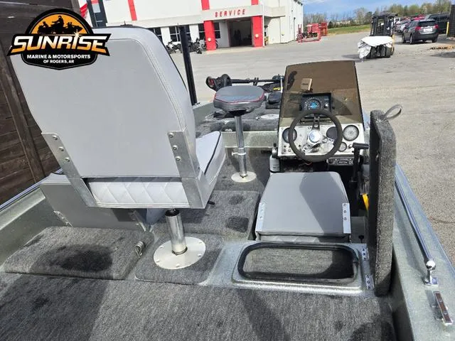 Slide: The Image of 1984 Champion CHAMP 2 boat interior with steering wheel and seating at Sunrise Marine & Motorsports. - 18