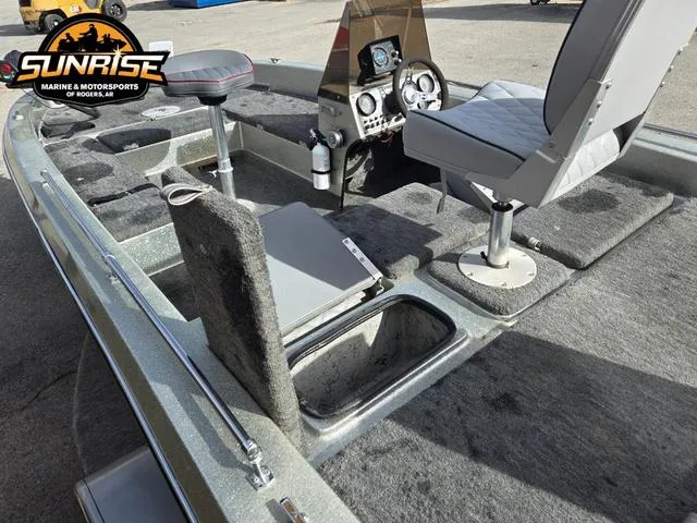 Slide: The Image of 1984 Champion CHAMP 2 boat interior with seats and dashboard, featuring storage compartments. - 19