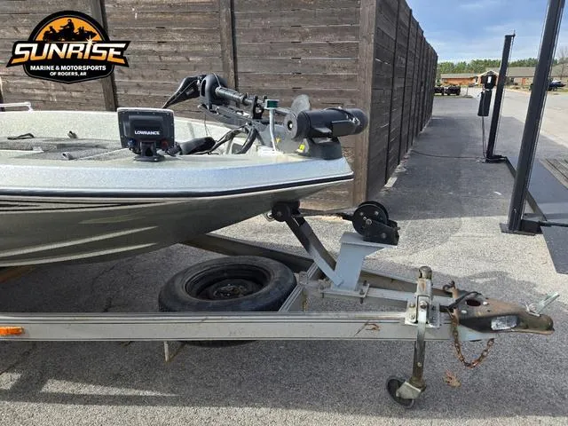 Slide: The Image of 1984 Champion CHAMP 2 boat on trailer, featuring Lowrance equipment, at Sunrise Marine & Motorsports. - 3