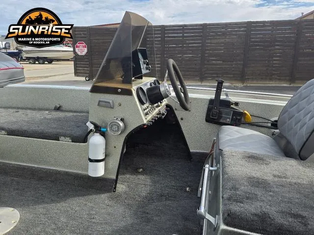 Slide: The Image of 1984 Champion CHAMP 2 boat interior with steering wheel and controls, Sunrise Marine logo visible. - 6