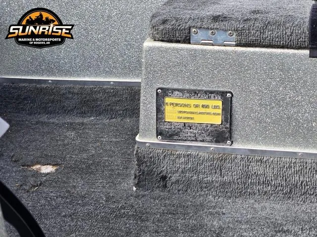 Slide: The Image of 1984 Champion CHAMP 2 boat interior with capacity label, textured carpet, and Sunrise Marine logo. - 8