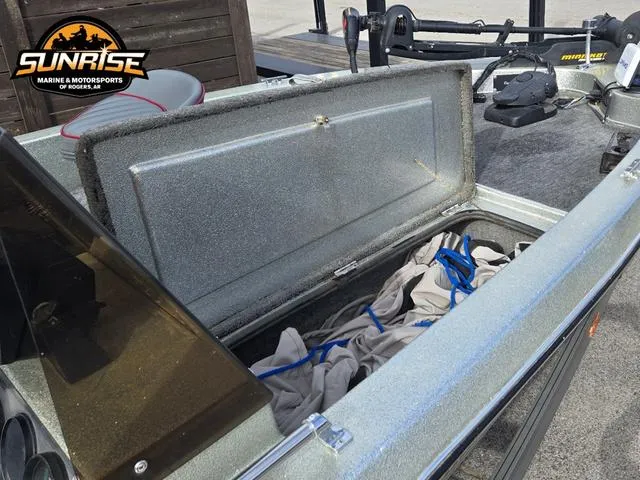 Slide: The Image of 1984 Champion CHAMP 2 boat storage compartment open, showcasing interior space and equipment. - 9