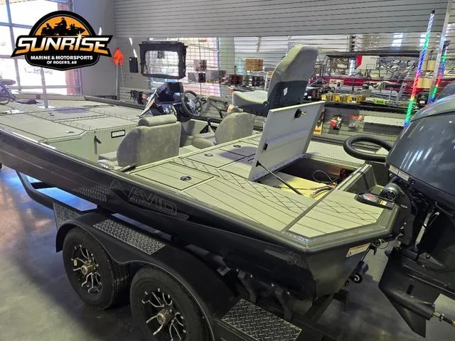 Slide: The Image of 2025 Avid 20 Vertex boat displayed at Sunrise Marine & Motorsports showroom. - 17