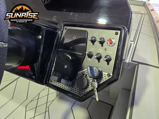 Slide: The Image of Control panel of 2025 Avid 20 Vertex boat with ignition keys and switches. - 5