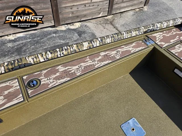 Slide: The Image of 2025 Avid 16 Commander boat interior with camouflage accents and measurement markings. - 6