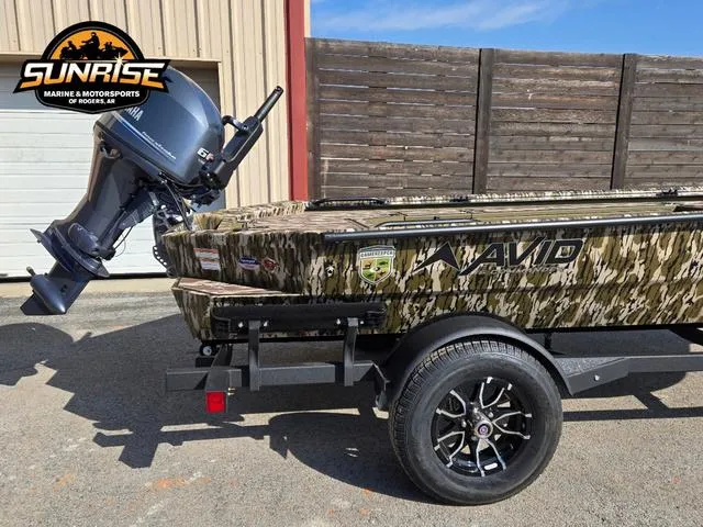 Slide: The Image of 2025 Avid 16 Commander boat with camouflage design on a trailer at Sunrise Marine. - 8
