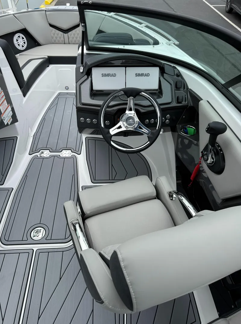 Slide: The Image of 2025 Monterey 235 Super Sport boat interior with modern dashboard and steering wheel. - 7