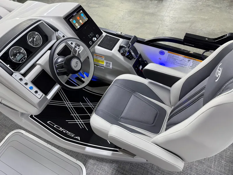 Slide: The Image of 2025 Barletta Corsa 23UC boat interior with modern dashboard and comfortable seating. - 11