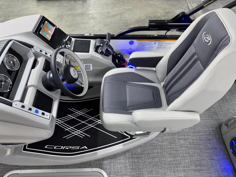 Slide: The Image of 2025 Barletta Corsa 23UC boat cockpit with modern steering and comfortable seating. - 12