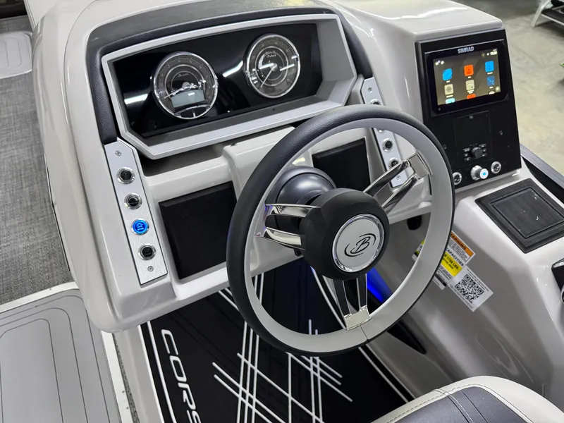 Slide: The Image of 2025 Barletta Corsa 23UC dashboard with steering wheel, gauges, and digital display. - 14