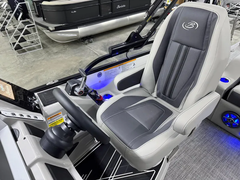 Slide: The Image of 2025 Barletta Corsa 23UC boat interior with sleek captain's chair and modern controls. - 17