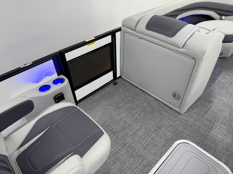 Slide: The Image of 2025 Barletta Corsa 23UC interior with gray seating, cup holders, and modern design. - 20