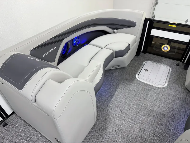 Slide: The Image of 2025 Barletta Corsa 23UC interior with sleek gray seating and ambient blue lighting. - 27