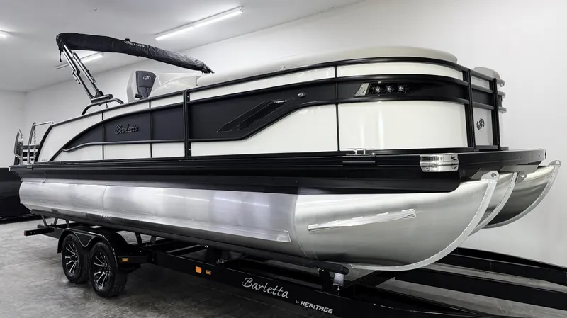 Slide: The Image of 2025 Barletta Corsa 23UC pontoon boat on trailer in showroom. - 3