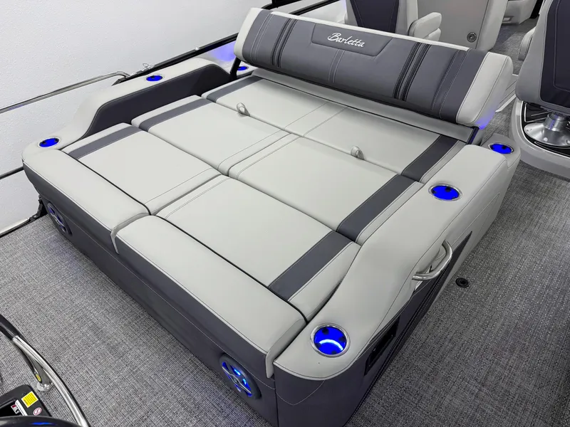 Slide: The Image of 2025 Barletta Corsa 23UC boat interior with gray seating and illuminated cup holders. - 6