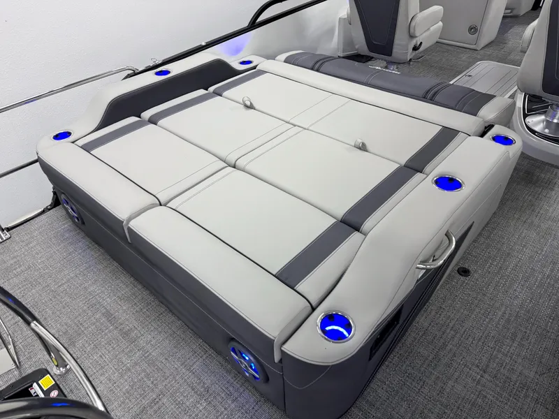 Slide: The Image of 2025 Barletta Corsa 23UC boat interior with luxurious seating and blue LED cup holders. - 7