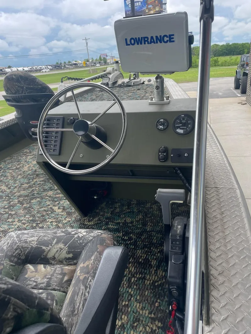 Slide: The Image of 2016 Hanko 20-6 boat interior with steering wheel and Lowrance navigation system. - 3