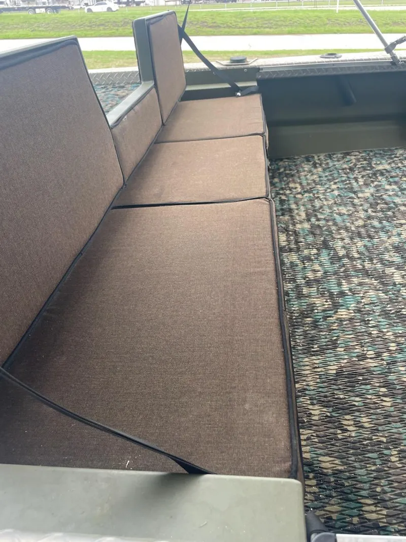 Slide: The Image of Hanko 20-6 boat interior with brown cushioned seats and patterned flooring, 2016 model. - 4