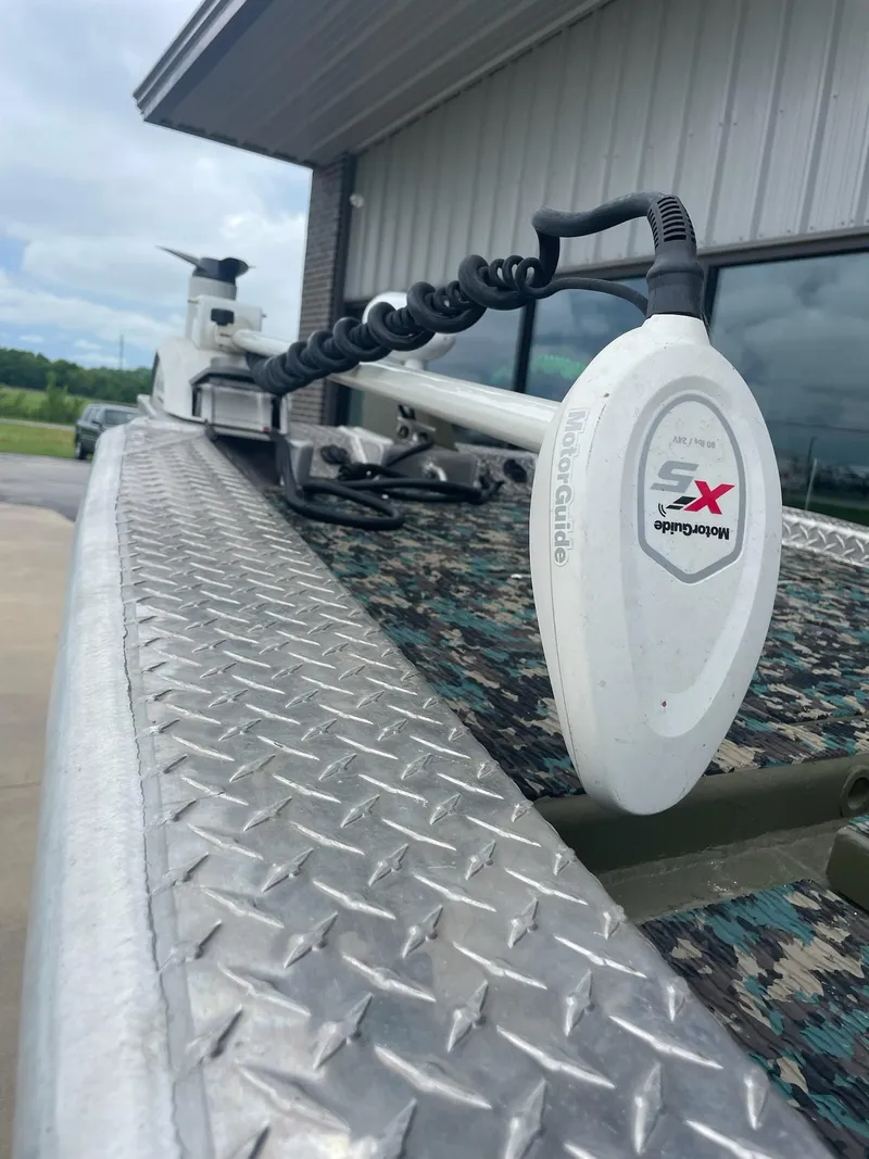 Slide: The Image of Hanko 20-6 boat with trolling motor, diamond plate deck, outdoors, cloudy sky, 2016 model. - 7